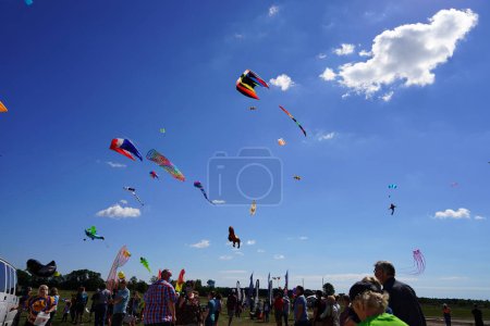 Photo for Two rivers, Wisconsin / USA - September 5th, 2020: Family members and children having a wonderful time at kites over lake michigan at two rivers high school. - Royalty Free Image