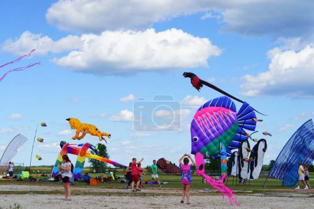 Photo for Two rivers, Wisconsin / USA - September 5th, 2020: Family members and children having a wonderful time at kites over lake michigan at two rivers high school - Royalty Free Image