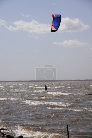 Photo for Fond du Lac, Wisconsin, USA - May 3rd, 2020: Locals from Fond du Lac and out of state members enjoyed windsurfing and kitesurfing out on Winnebago Lake went against safer at home coronavirus pandemic - Royalty Free Image