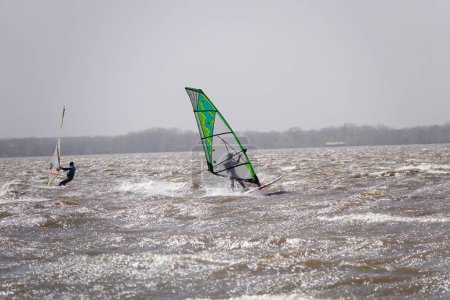 Photo for Fond du Lac, Wisconsin, USA - May 3rd, 2020: Locals from Fond du Lac and out of state members enjoyed windsurfing and kitesurfing out on Winnebago Lake went against safer at home coronavirus pandemic - Royalty Free Image