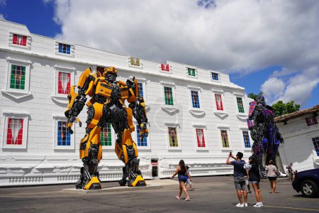Photo for Wisconsin Dells, Wisconsin USA - July 25th, 2022: Transformer Optimus Prime and Bumblebee replica statues standing in front of Top Secret Attraction. - Royalty Free Image
