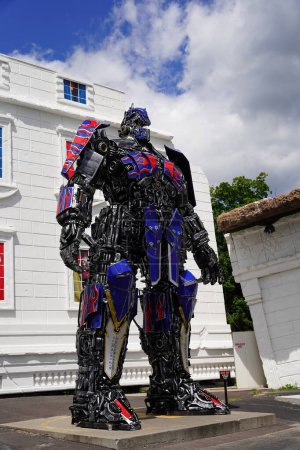 Photo for Wisconsin Dells, Wisconsin USA - July 25th, 2022: Transformer Optimus Prime and Bumblebee replica statues standing in front of Top Secret Attraction. - Royalty Free Image