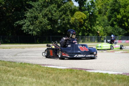 Photo for Dousman, Wisconsin USA - August 8th, 2019: Adult go-kart drivers raced in national races at Badger Kart club Wolf Paving Raceway. - Royalty Free Image