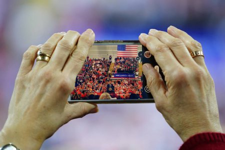Photo for Milwaukee, Wisconsin / USA - January 14th, 2020: 45th President Donald Trump supporters using their smartphones to capture the Make America Great Again Rally at UW-Milwaukee Panther Arena - Royalty Free Image