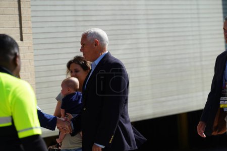 Photo for Milwaukee, Wisconsin USA - August 23rd, 2023: Former Vice President Mike Pence being escorted inside the Fiserv Forum to participate at the 2024 Republican Presidential Debate. - Royalty Free Image
