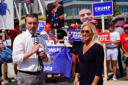 Photo for Milwaukee, Wisconsin USA - August 23rd, 2023: United States Representative Marjorie Taylor Greene gave interviews with the press and media and interacted with Trump supporters at the Fiserv Forum - Royalty Free Image