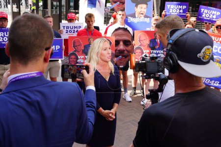 Photo for Milwaukee, Wisconsin USA - August 23rd, 2023: United States Representative Marjorie Taylor Greene gave interviews with the press and media and interacted with Trump supporters at the Fiserv Forum. - Royalty Free Image