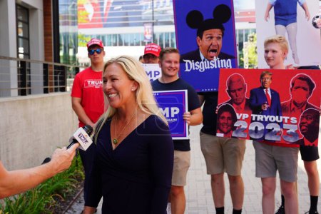 Photo for Milwaukee, Wisconsin USA - August 23rd, 2023: United States Representative Marjorie Taylor Greene gave interviews with the press and media and interacted with Trump supporters at the Fiserv Forum. - Royalty Free Image