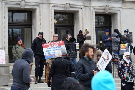 Photo for Kenosha, Wisconsin USA - November 18th, 2021: Protesters and supporters of Kyle Rittenhouse gather outside at Kenosha county courthouse during the jury deliberations of the case. - Royalty Free Image