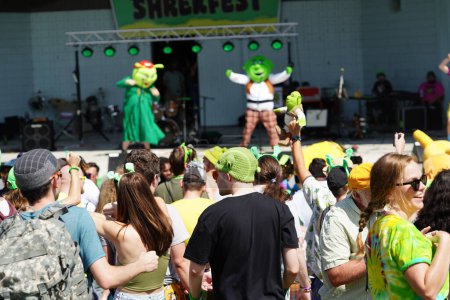 Photo for Milwaukee, Wisconsin USA - September 2nd, 2023: Fans of the Shrek Movie dressed up in Shrek character costumes jumped around and danced to theme songs at Shrekfest 2023. - Royalty Free Image