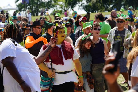Photo for Milwaukee, Wisconsin USA - September 2nd, 2023: Fans of the Shrek Movie dressed up in Shrek character costumes jumped around and danced to theme songs at Shrekfest 2023. - Royalty Free Image