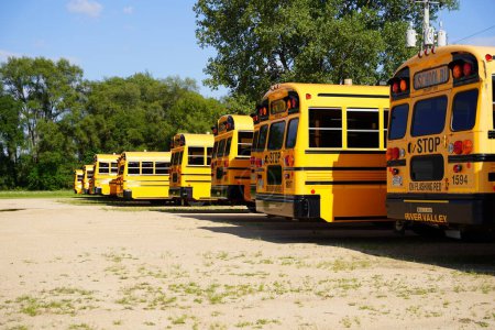 Photo for Tomah, Wisconsin USA - July 2nd, 2023: Short yellow school buses still together ready to be used. - Royalty Free Image
