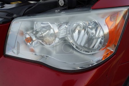 Photo for Headlights on red 2013 van. - Royalty Free Image