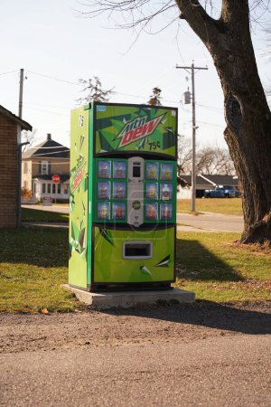 Photo for Mauston, Wisconsin USA - November 20th, 2020: Abandon mountain dew soda bottle machine sits outside in the neighborhood of maustion. - Royalty Free Image