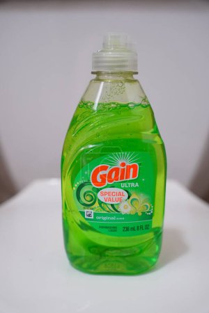 Photo for New Lisbon, Wisconsin USA - February 1st, 2023: Green bottle of 10 fl oz of Gain laundry detergent. - Royalty Free Image