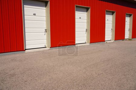 Photo for Red storage unit buildings site outside of Fond du Lac, Wisconsin holding owers property. - Royalty Free Image