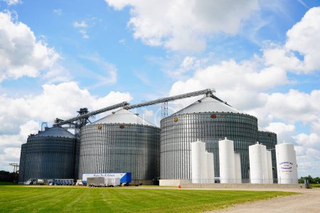 Photo for New Lisbon, Wisconsin USA - April 20th, 2023: Grain silos and grain elevators sit on farmland. - Royalty Free Image