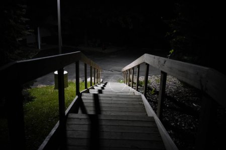 Photo for Dark night scene with wooden stairs and lanterns in dark forest - Royalty Free Image