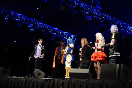 Photo for Milwaukee, Wisconsin USA - February 13th, 2020: People dressed up in Marvel costumes, DC comics costumes, anime and manga costumes participating in anime milwaukee masquerade contest - Royalty Free Image