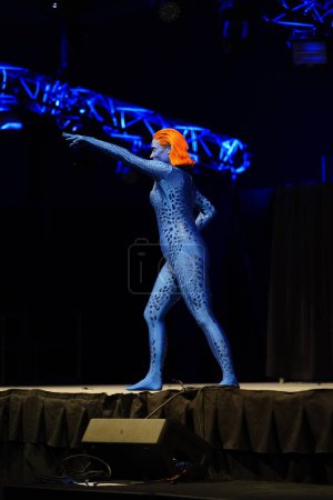 Photo for Milwaukee, Wisconsin USA - February 13th, 2020: Female dressed up in marvel x-men mystique cosplay costume to participate in anime Milwaukee masquerade contest. - Royalty Free Image