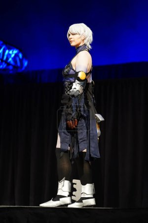 Photo for Milwaukee, Wisconsin USA - February 13th, 2020: Female dressed up in Marvel costumes, DC comics costumes, anime and manga costumes participating in anime milwaukee masquerade contest. - Royalty Free Image