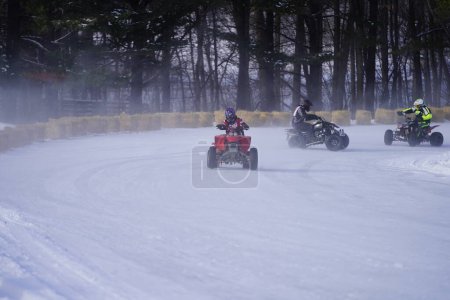 Photo for Hortonville, Wisconsin / USA - January 26th, 2019: Many riders on Quad-bikes and ATVs were having fun riding around on snow covered frozen iced lake. - Royalty Free Image