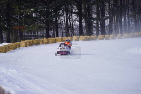 Photo for Hortonville, Wisconsin / USA - January 26th, 2019: Many riders on snowmobiles were having fun riding around on snow covered frozen iced lake. - Royalty Free Image