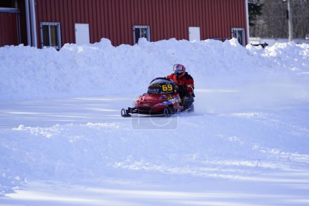 Photo for Hortonville, Wisconsin / USA - January 26th, 2019: Many riders on snowmobiles were having fun riding around on snow covered frozen iced lake - Royalty Free Image