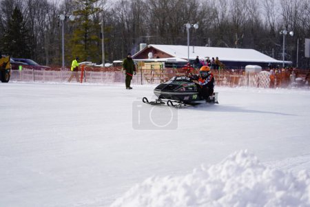 Photo for Hortonville, Wisconsin / USA - January 26th, 2019: Many riders on snowmobiles were having fun riding around on snow covered frozen iced lake - Royalty Free Image