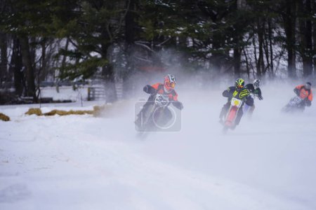 Photo for Hortonville, Wisconsin / USA - January 26th, 2019: Many riders on dirt bikes were having fun riding around on snow covered frozen iced lake - Royalty Free Image