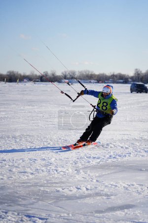 Photo for Fond du Lac, Wisconsin USA - February 8th, 2019: Locals from the fond du lac community enjoyed winter ice kite windsurfing on the frozen lake of winnebago. - Royalty Free Image