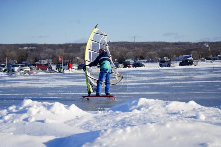 Photo for Fond du Lac, Wisconsin USA - February 8th, 2019: Fond du Lac community Locals enjoyed winter ice kite windsurfing on the frozen lake of Winnebago. - Royalty Free Image