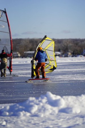 Photo for Fond du Lac, Wisconsin USA - February 8th, 2019: Fond du Lac community Locals enjoyed winter ice kite windsurfing on the frozen lake of Winnebago. - Royalty Free Image