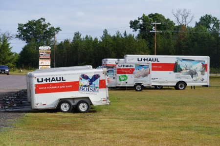 Photo for Mauston, Wisconsin USA - September 11th, 2023: U Haul truck and trailers sit outside ready to be used by customers. - Royalty Free Image
