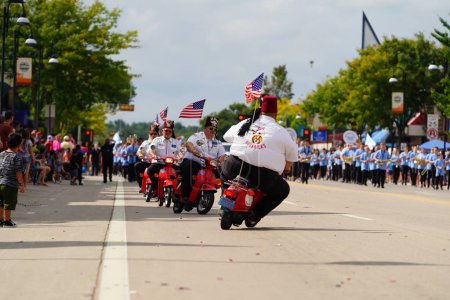 Photo for Wisconsin Dells, Wisconsin USA - September 18th, 2023: ZOR Mavericks on mopeds drove around in Wo Zha Wa fall festival parade. - Royalty Free Image