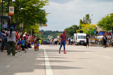 Photo for Wisconsin Dells, Wisconsin USA - September 18th, 2022: Man in Spider-Man costume interacted with spectators at a Fall Festival parade. - Royalty Free Image