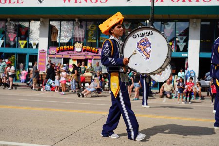 Photo for Warrens, Wisconsin USA - September 25th, 2022: Mauston High School Cheese Head marching band marched in Cranfest parade 2022. - Royalty Free Image