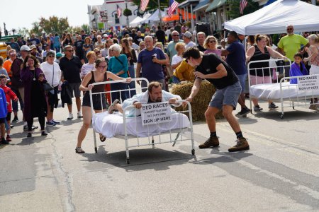 Photo for Green Lake, Wisconsin USA - September 23rd, 2023: Community members enjoyed a family event of bed racing on the streets of Green Lake. - Royalty Free Image