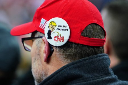 Photo for Milwaukee, Wisconsin / USA - January 14th, 2020: Anti-CNN "You Are Fake News", pin pinned to a 45th President Donald Trump supporter's hat at UW-Milwaukee Panther Arena Make America Great Again. - Royalty Free Image