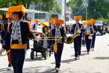 Photo for Warrens, Wisconsin USA - September 25th, 2022: Mauston High School Cheese Head marching band marched in Cranfest parade 2022. - Royalty Free Image