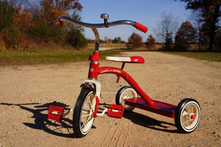 Photo for New Lisbon, Wisconsin USA - October 22nd, 2022: Toddler Radio Flyer Red Tricycle. - Royalty Free Image