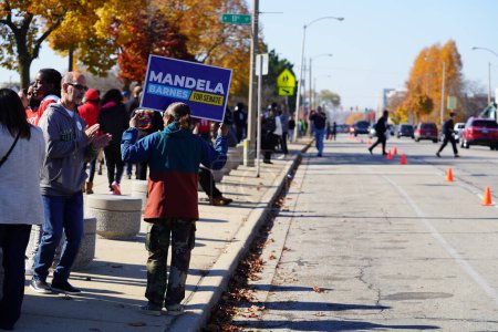 Photo for Milwaukee, Wisconsin USA - October 29th, 2022: Many Democrat voters lined up at North Division High school to participate at Governor Tony Evers, Mandela Barnes and Barack Obama Democratic party rally - Royalty Free Image