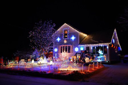 Photo for New Lisbon, Wisconsin USA- December 16th, 2022: Home owners decorate their houses and property during the Christmas Holiday. - Royalty Free Image