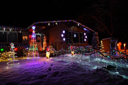 Photo for New Lisbon, Wisconsin USA- December 16th, 2022: Home owners decorate their houses and property during the Christmas Holiday. - Royalty Free Image
