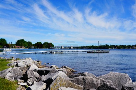 Photo for Landscape view of the waters of Sturgeon Bay, Wisconsin flooding onto the shore line of Sturgeon Bay. - Royalty Free Image