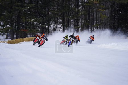 Photo for Fond du Lac, Wisconsin / USA - January 20th, 2019: Many riders on dirt bikes rode around on the frozen lake of Kettle Moraine. - Royalty Free Image