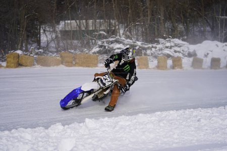 Photo for Fond du Lac, Wisconsin / USA - January 20th, 2019: Many riders on dirt bikes rode around on the frozen lake of Kettle Moraine. - Royalty Free Image