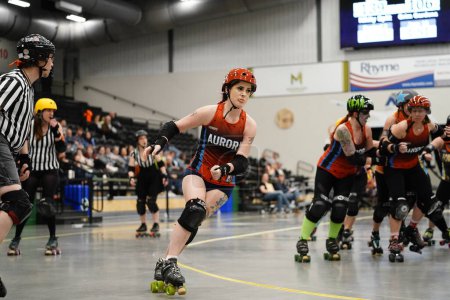 Photo for Oshkosh, Wisconsin USA  - October 12th, 2020: Adult females play in physical contact Roller Derby teams and compete against each other at Oshkosh Arena. - Royalty Free Image