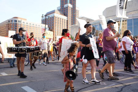 Photo for Milwaukee, Wisconsin / USA - August 20th, 2020: Coalition to march on the DNC protesters of black lives matter and climate change activists protested through the streets to the wisconsin center. - Royalty Free Image