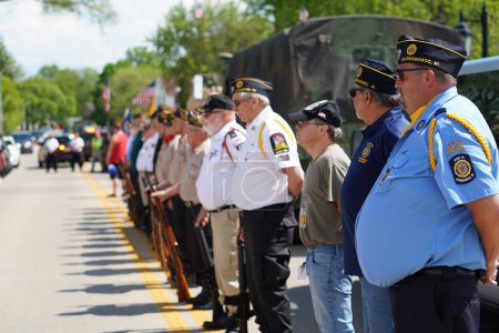 Photo for Oconomowoc, Wisconsin / USA - May 25th, 2020: Senior military officers and veterans stand in formation to honor fallen soldiers for memorial day despite the social distance order cause of covid-19. - Royalty Free Image